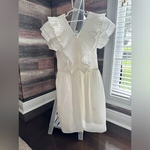 White dress worn once for confirmation. V neck with ruffle sleeves